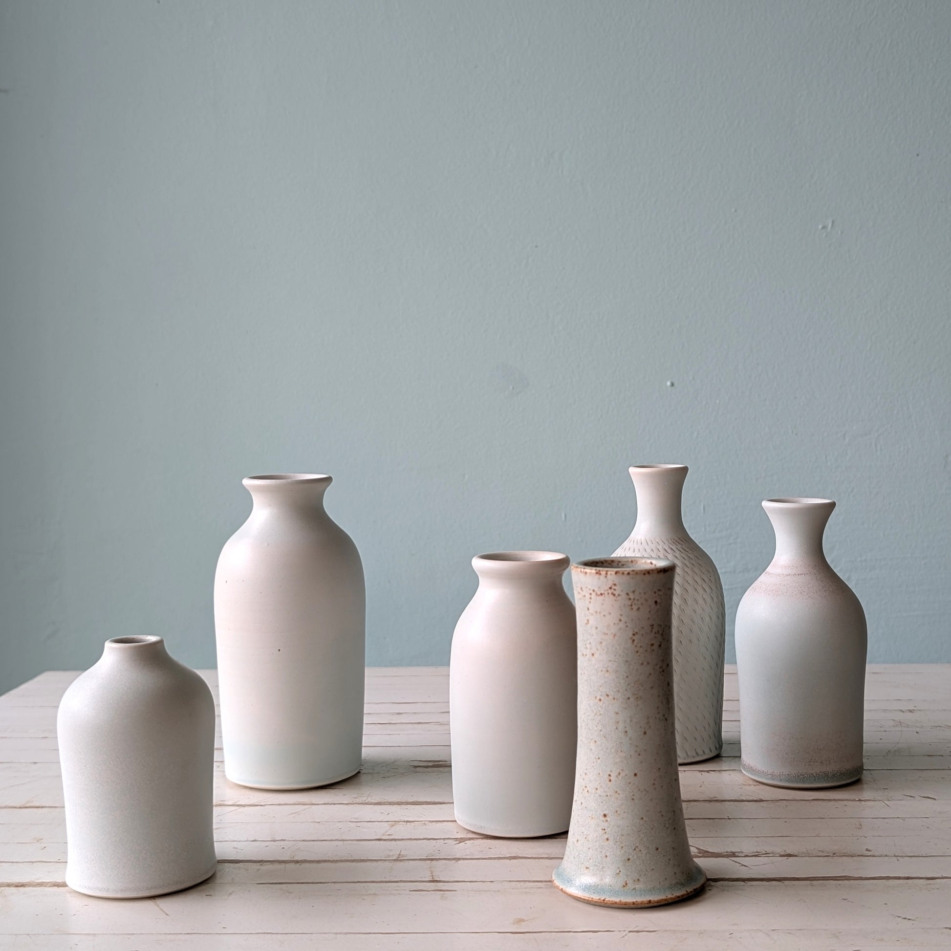 Collection of 6 pale blue matte bud vases by Asahi So