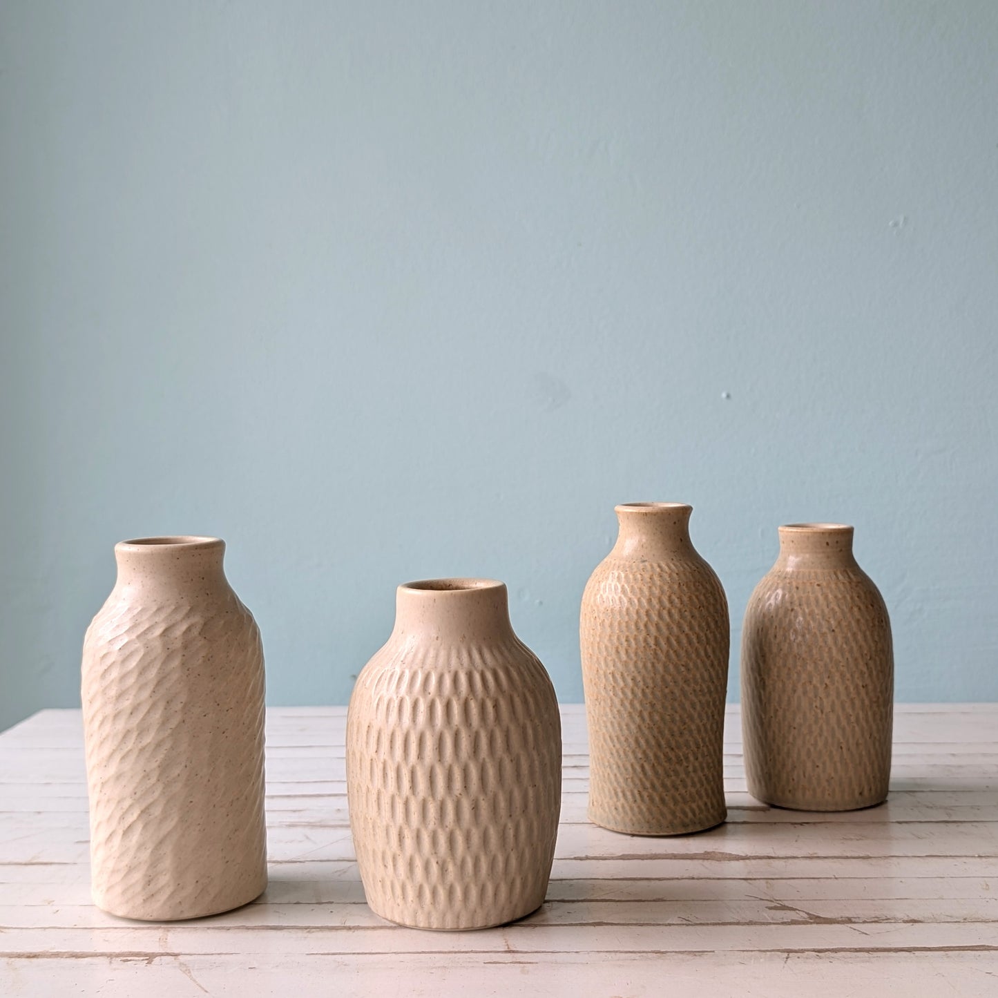 Four sand coloured textured bud vases by Asahi So