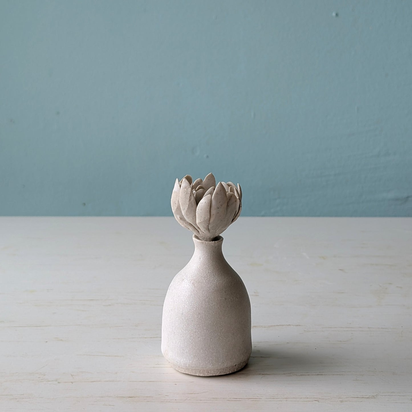 Small ceramic perfume bottle with succulent shaped lid