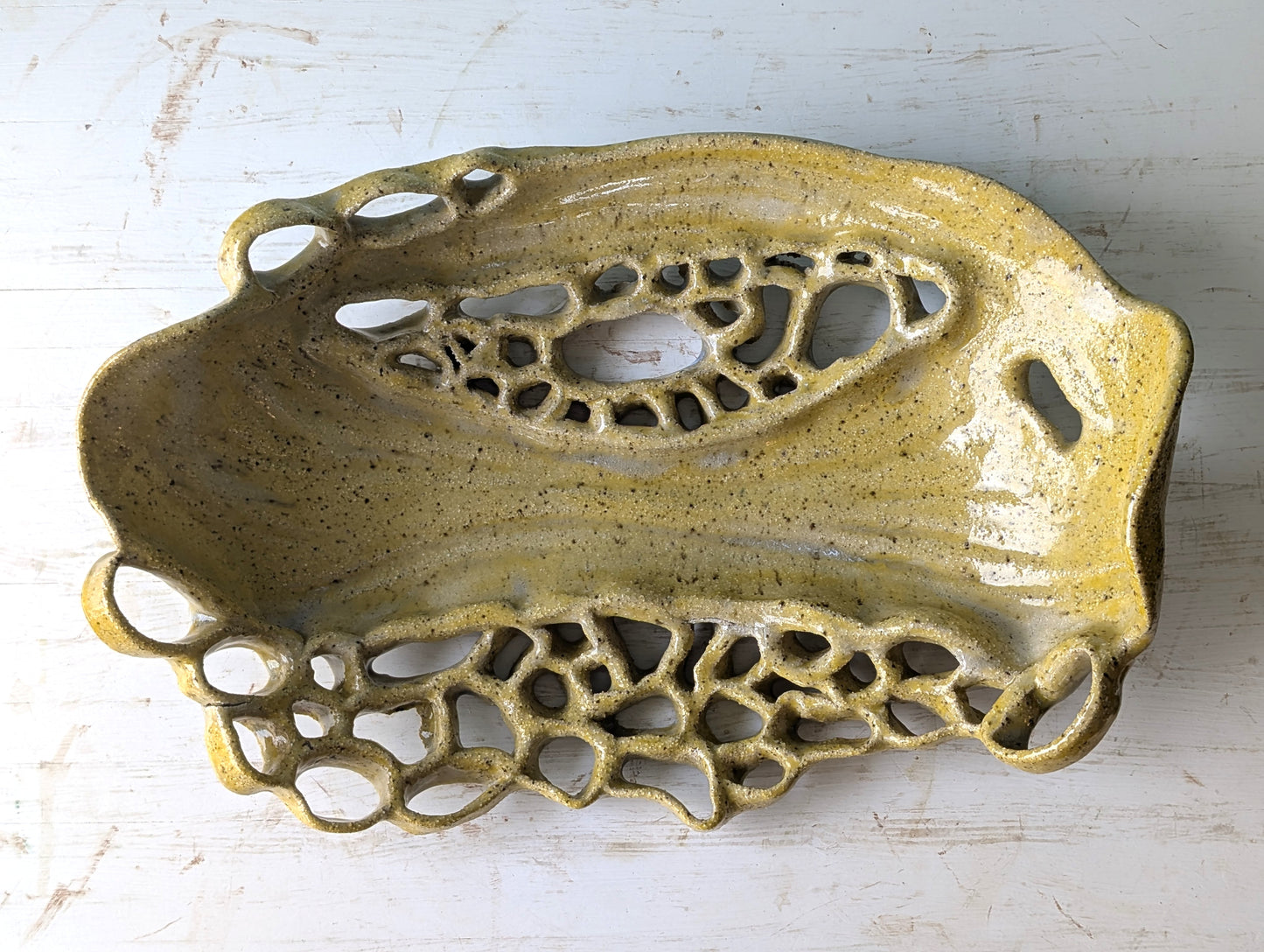 Decorative ceramic platter with intricate design on a white background