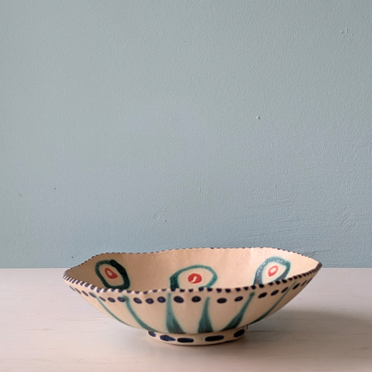 Ceramic bowl with decorative patterns on a plain background