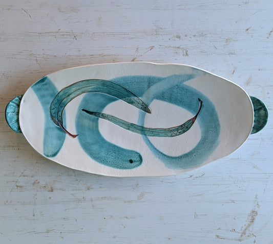 White ceramic oval platter with green leaf design