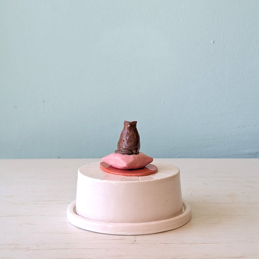 White ceramic butter dish with cat design on top