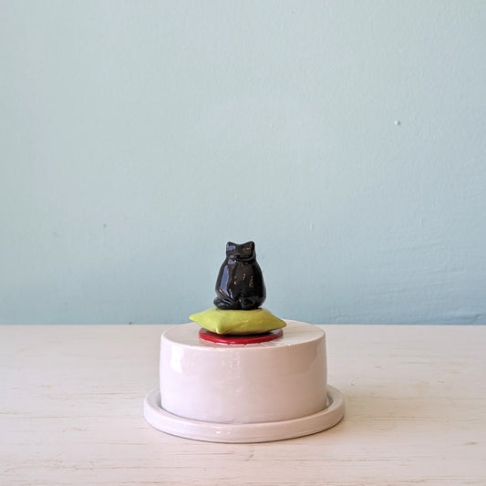 White ceramic butter dish with black cat accent on top