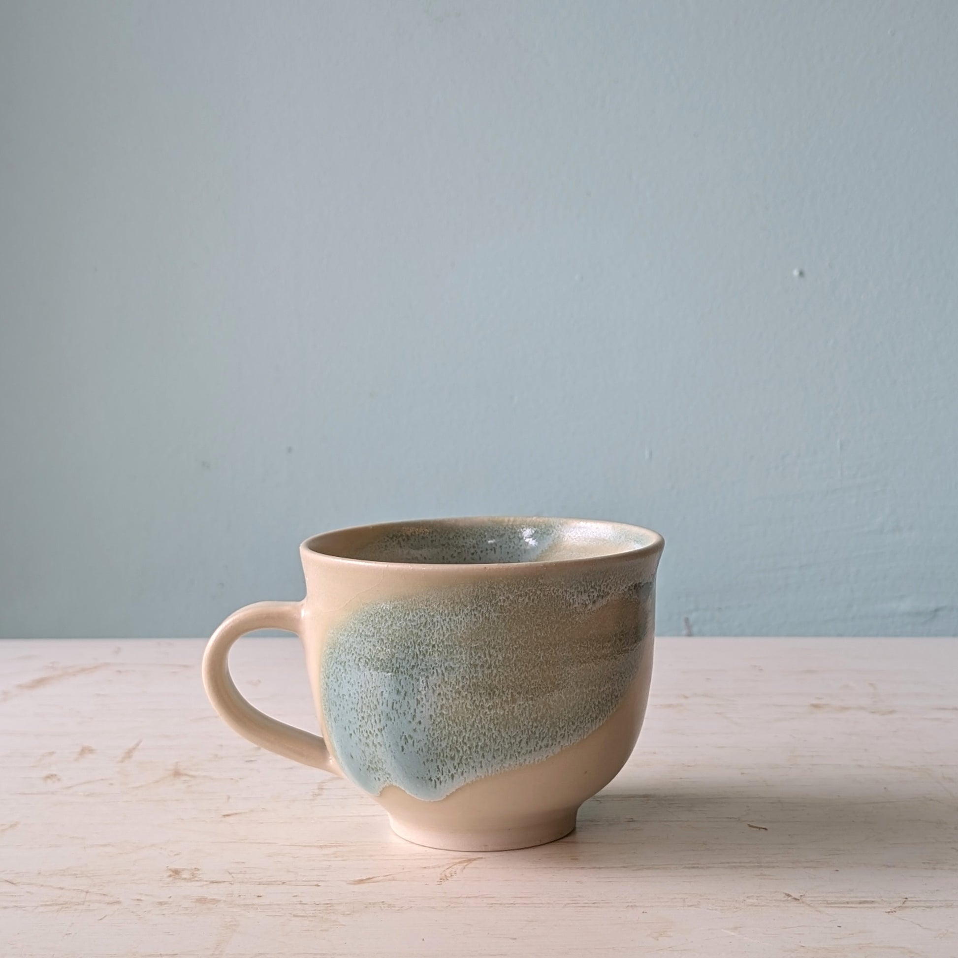 Large ceramic mug with green abstract pattern