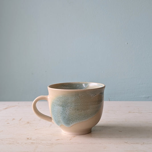 Large ceramic mug with green abstract pattern