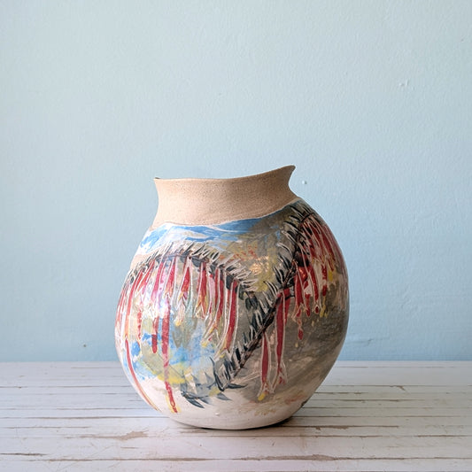 Ceramic vase with abstract pattern in red, yellow and blue