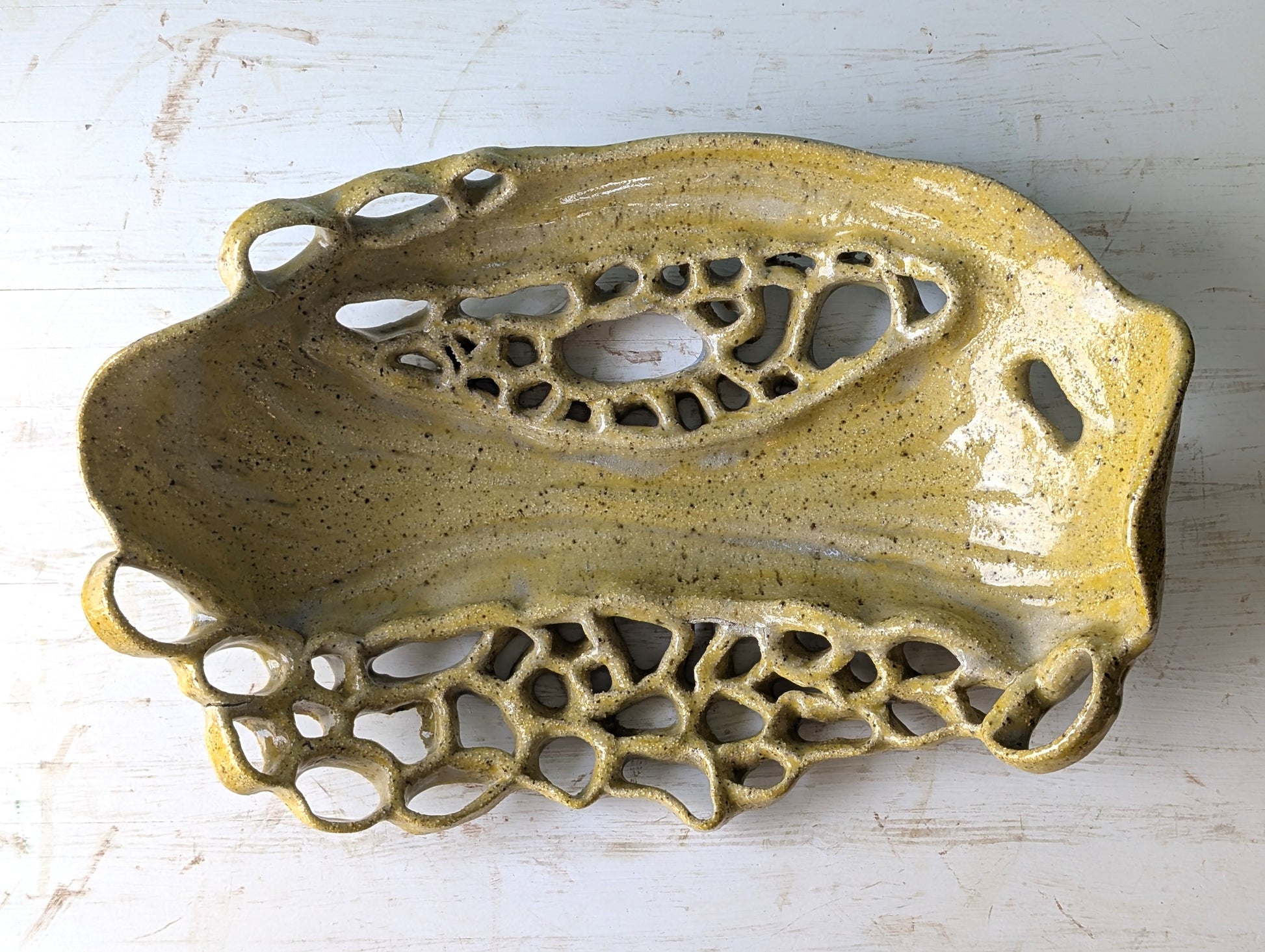 Decorative ceramic platter with intricate design on a white background