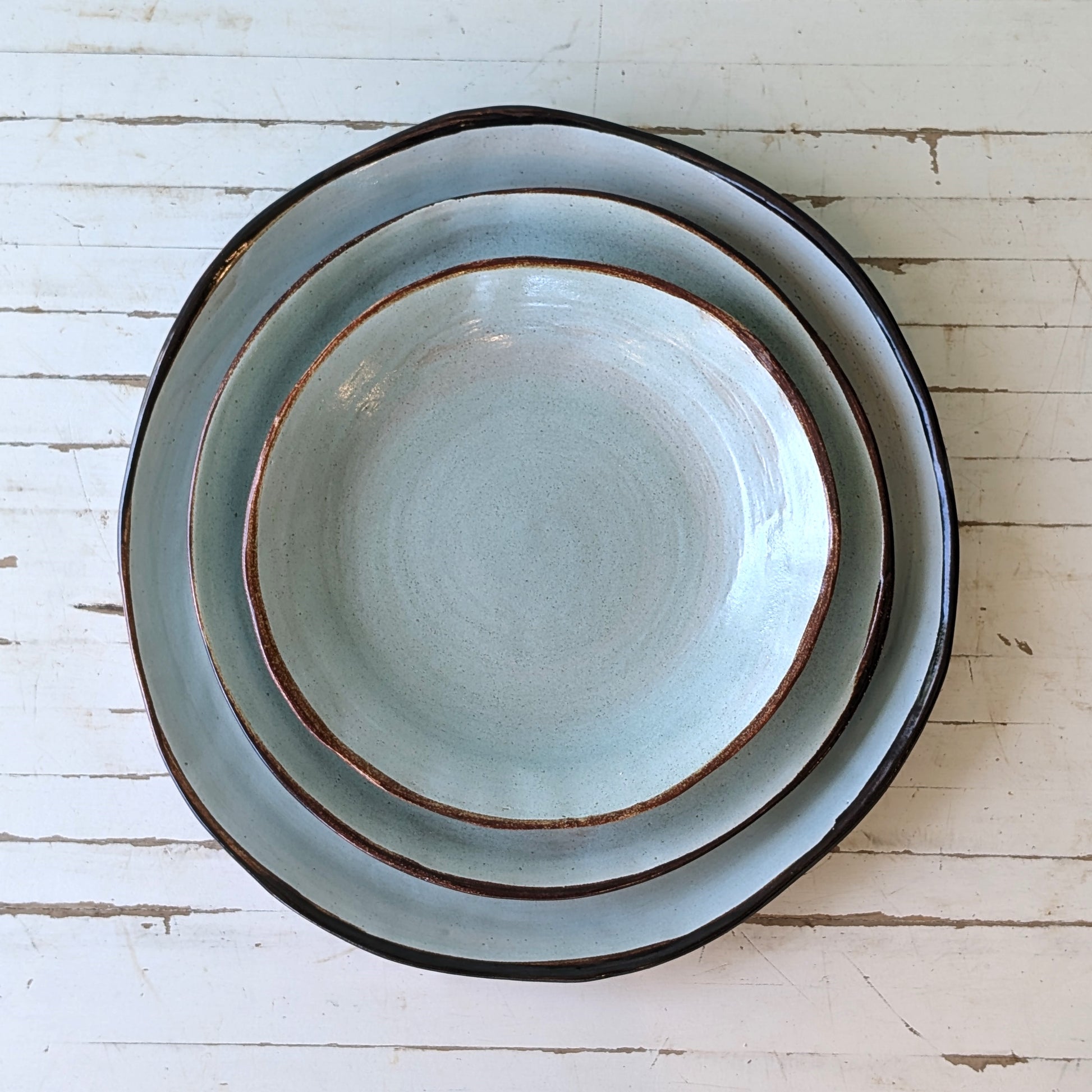 Therese McMahon plates assorted sizes light blue